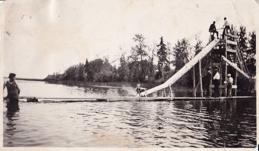 Historical image of wooden waterslide at Killdeer Beach Resort in Lac la Nonne, Alberta.